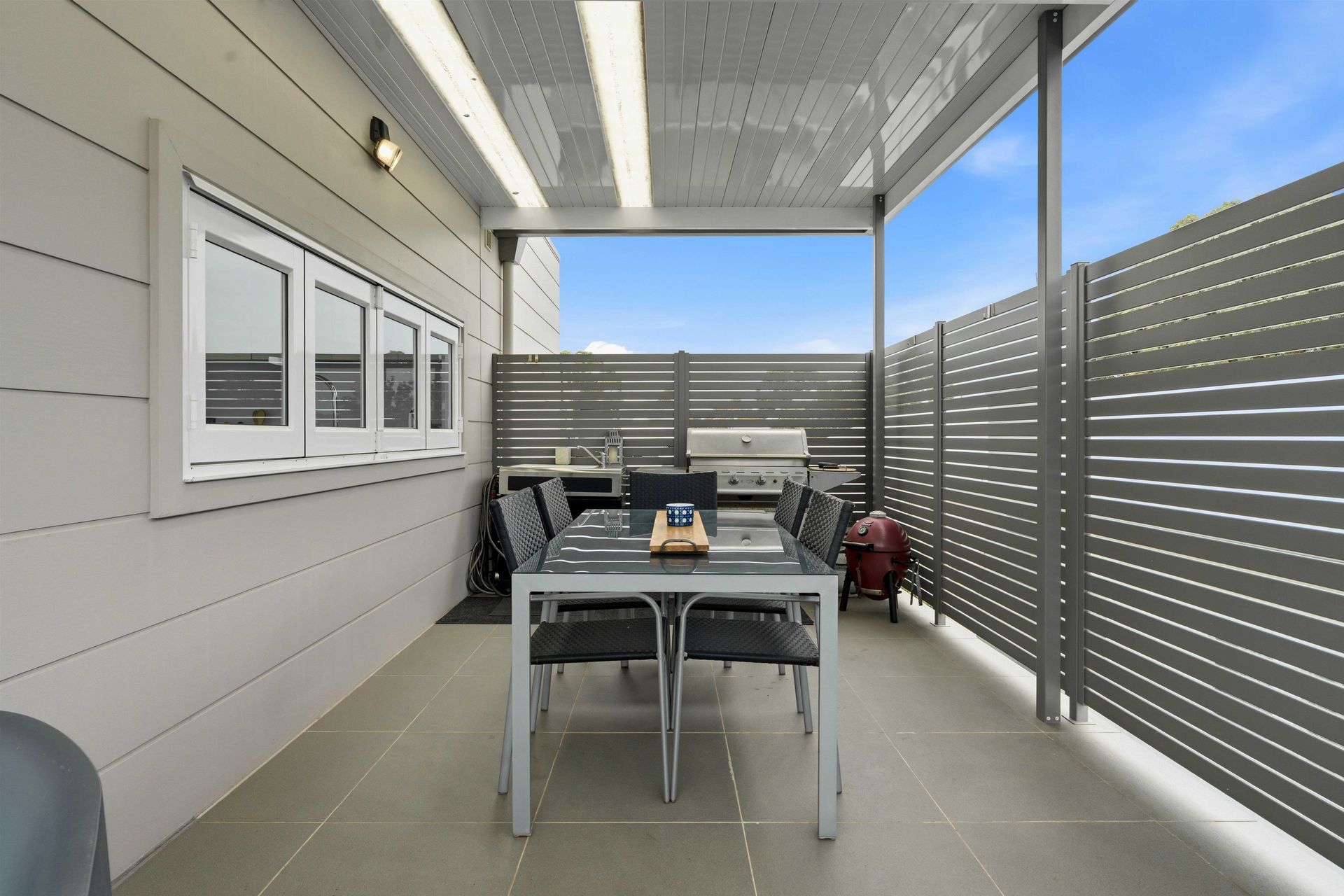 Undercover alfresco dining table and BBQ on the upstairs deck
